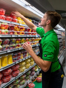 Publix associate stocking shelves